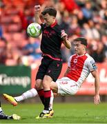 13 June 2025; Anto Breslin of St Patrick's Athletic has a shot on goal blocked by Darragh Markey of Drogheda United during the SSE Airtricity Men's Premier Division match between St Patrick's Athletic and Drogheda United at Richmond Park in Dublin. Photo by Shauna Clinton/Sportsfile