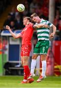 13 June 2025; Sean Boyd of Shelbourne in action against Daniel Cleary of Shamrock Rovers during the SSE Airtricity Men's Premier Division match between Shelbourne and Shamrock Rovers at Tolka Park in Dublin. Photo by Stephen McCarthy/Sportsfile