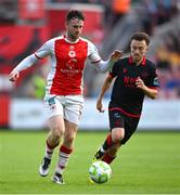 13 June 2025; Jay McClelland of St Patrick's Athletic in action against Darragh Markey of Drogheda United during the SSE Airtricity Men's Premier Division match between St Patrick's Athletic and Drogheda United at Richmond Park in Dublin. Photo by Shauna Clinton/Sportsfile