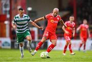 13 June 2025; Mark Coyle of Shelbourne in action against Aaron McEneff of Shamrock Rovers during the SSE Airtricity Men's Premier Division match between Shelbourne and Shamrock Rovers at Tolka Park in Dublin. Photo by Stephen McCarthy/Sportsfile