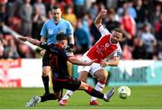 13 June 2025; Ryan McLaughlin of St Patrick's Athletic is tackled by Luke Heeney of Drogheda United during the SSE Airtricity Men's Premier Division match between St Patrick's Athletic and Drogheda United at Richmond Park in Dublin. Photo by Shauna Clinton/Sportsfile