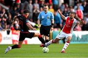 13 June 2025; Ryan McLaughlin of St Patrick's Athletic is tackled by Luke Heeney of Drogheda United during the SSE Airtricity Men's Premier Division match between St Patrick's Athletic and Drogheda United at Richmond Park in Dublin. Photo by Shauna Clinton/Sportsfile