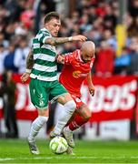13 June 2025; Danny Grant of Shamrock Rovers in action against Mark Coyle of Shelbourne during the SSE Airtricity Men's Premier Division match between Shelbourne and Shamrock Rovers at Tolka Park in Dublin. Photo by Sam Barnes/Sportsfile