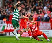 13 June 2025; Danny Grant of Shamrock Rovers in action against Paddy Barrett, right, and Mark Coyle of Shelbourne during the SSE Airtricity Men's Premier Division match between Shelbourne and Shamrock Rovers at Tolka Park in Dublin. Photo by Sam Barnes/Sportsfile