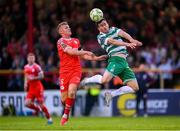 13 June 2025; Aaron Greene of Shamrock Rovers in action against JJ Lunney of Shelbourne during the SSE Airtricity Men's Premier Division match between Shelbourne and Shamrock Rovers at Tolka Park in Dublin. Photo by Stephen McCarthy/Sportsfile