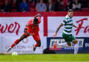13 June 2025; Mipo Odubeko of Shelbourne in action against Lee Grace of Shamrock Rovers during the SSE Airtricity Men's Premier Division match between Shelbourne and Shamrock Rovers at Tolka Park in Dublin. Photo by Stephen McCarthy/Sportsfile