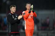 13 June 2025; Drogheda United players Conor Kane, left, and goalkeeper Luke Dennison acknowledge supporters after the SSE Airtricity Men's Premier Division match between St Patrick's Athletic and Drogheda United at Richmond Park in Dublin. Photo by Shauna Clinton/Sportsfile