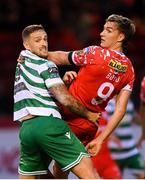 13 June 2025; Lee Grace of Shamrock Rovers in action against Sean Boyd of Shelbourne during the SSE Airtricity Men's Premier Division match between Shelbourne and Shamrock Rovers at Tolka Park in Dublin. Photo by Stephen McCarthy/Sportsfile