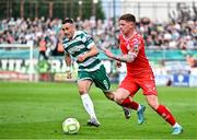 13 June 2025; Kameron Ledwidge of Shelbourne in action against Aaron McEneff of Shamrock Rovers  during the SSE Airtricity Men's Premier Division match between Shelbourne and Shamrock Rovers at Tolka Park in Dublin. Photo by Sam Barnes/Sportsfile