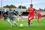 13 June 2025; Kameron Ledwidge of Shelbourne in action against Danny Grant of Shamrock Rovers during the SSE Airtricity Men's Premier Division match between Shelbourne and Shamrock Rovers at Tolka Park in Dublin. Photo by Sam Barnes/Sportsfile