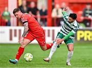 13 June 2025; Kameron Ledwidge of Shelbourne in action against Danny Mandroiu of Shamrock Rovers during the SSE Airtricity Men's Premier Division match between Shelbourne and Shamrock Rovers at Tolka Park in Dublin. Photo by Sam Barnes/Sportsfile