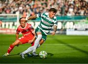 13 June 2025; Danny Grant of Shamrock Rovers in action against James Norris of Shelbourne during the SSE Airtricity Men's Premier Division match between Shelbourne and Shamrock Rovers at Tolka Park in Dublin. Photo by Sam Barnes/Sportsfile