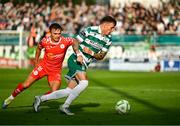 13 June 2025; Danny Grant of Shamrock Rovers in action against James Norris of Shelbourne during the SSE Airtricity Men's Premier Division match between Shelbourne and Shamrock Rovers at Tolka Park in Dublin. Photo by Sam Barnes/Sportsfile