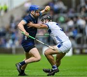 14 June 2025; John McGrath of Tipperary in action against Lee Cleere of Laois during the GAA Hurling All-Ireland Senior Championship Round 1 match between Laois and Tipperary at Laois Hire O'Moore in Portlaoise, Laois. Photo by Daire Brennan/Sportsfile