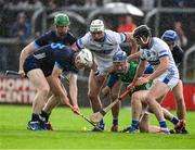 14 June 2025; Oisin O'Donoghue of Tipperary in action against Laois players, left to right, Ryan Mullaney, Cathal Dunne, and Donnacha Hartnett during the GAA Hurling All-Ireland Senior Championship Round 1 match between Laois and Tipperary at Laois Hire O'Moore in Portlaoise, Laois. Photo by Daire Brennan/Sportsfile