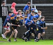 14 June 2025; Young Tipperary players run onto the pitch after the GAA Hurling All-Ireland Senior Championship Round 1 match between Laois and Tipperary at Laois Hire O'Moore in Portlaoise, Laois. Photo by Daire Brennan/Sportsfile