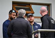 14 June 2025; Umpires Mark Hawthorne and Johnny Kennedy in conversation with West Indies captain Shai Hope, left, and Ireland captain Paul Stirling before abandoning match two of the T20 International Series between Ireland and the West Indies at Bready Cricket Club in Magheramason, Tyrone. Photo by Sam Barnes/Sportsfile