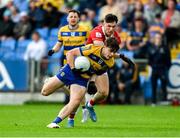 14 June 2025; Ben O'Carroll of Roscommon in action against Seán Brady of Cork during the GAA Football All-Ireland Senior Championship Round 3 match between Roscommon and Cork at Laois Hire O'Moore Park in Portlaoise, Laois. Photo by Daire Brennan/Sportsfile