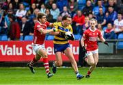 14 June 2025; Enda Smith of Roscommon in action against Ian Maguire of Cork during the GAA Football All-Ireland Senior Championship Round 3 match between Roscommon and Cork at Laois Hire O'Moore Park in Portlaoise, Laois. Photo by Daire Brennan/Sportsfile