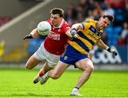 14 June 2025; Daniel O'Mahony of Cork in action against Diarmuid Murtagh of Roscommon during the GAA Football All-Ireland Senior Championship Round 3 match between Roscommon and Cork at Laois Hire O'Moore Park in Portlaoise, Laois. Photo by Daire Brennan/Sportsfile