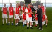 14 June 2025; League of Ireland director Mark Scanlon presents the cup to St Patrick's Athletic captain Bracey Daniels after winning the League of Ireland Walking Football Festival at the National Indoor Arena on the Sport Ireland Campus in Dublin. Photo by Stephen McCarthy/Sportsfile