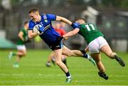 14 June 2025; Jason Foley of Kerry is fouled by Ruairi Kinsella of Meath during the GAA Football All-Ireland Senior Championship Round 3 match between Kerry and Meath at Glenisk O'Connor Park in Tullamore, Offaly. Photo by Tom Beary/Sportsfile
