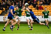 14 June 2025; Cathal Hickey of Meath scores a point despite the efforts of Paul Murphy of Kerry during the GAA Football All-Ireland Senior Championship Round 3 match between Kerry and Meath at Glenisk O'Connor Park in Tullamore, Offaly. Photo by Tom Beary/Sportsfile