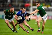 14 June 2025; Tom O'Sullivan of Kerry in action against Donal Keogan, left, and Eoghan Frayne of Meath during the GAA Football All-Ireland Senior Championship Round 3 match between Kerry and Meath at Glenisk O'Connor Park in Tullamore, Offaly. Photo by Tom Beary/Sportsfile