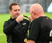 14 June 2025; League of Ireland director Mark Scanlon presents medals during the League of Ireland Walking Football Festival at the National Indoor Arena on the Sport Ireland Campus in Dublin. Photo by Stephen McCarthy/Sportsfile