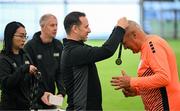 14 June 2025; League of Ireland director Mark Scanlon presents medals during the League of Ireland Walking Football Festival at the National Indoor Arena on the Sport Ireland Campus in Dublin. Photo by Stephen McCarthy/Sportsfile