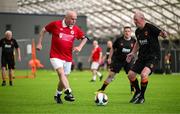 14 June 2025; John Rice of Sligo Rovers in action against Anthony Gossage of Cork City during the League of Ireland Walking Football Festival at the National Indoor Arena on the Sport Ireland Campus in Dublin. Photo by Stephen McCarthy/Sportsfile