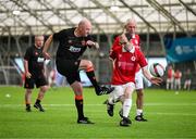 14 June 2025; Anthony Gossage of Cork City in action against Greg Clark of Sligo Rovers during the League of Ireland Walking Football Festival at the National Indoor Arena on the Sport Ireland Campus in Dublin. Photo by Stephen McCarthy/Sportsfile