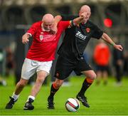 14 June 2025; John Rice of Sligo Rovers in action against Anthoyn Gossage of Cork City during the League of Ireland Walking Football Festival at the National Indoor Arena on the Sport Ireland Campus in Dublin. Photo by Stephen McCarthy/Sportsfile