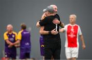 14 June 2025; Sean Curran of Wexford and St Patrick's Athletic goalkeeper Joe Curley embrace after their match during the League of Ireland Walking Football Festival at the National Indoor Arena on the Sport Ireland Campus in Dublin. Photo by Stephen McCarthy/Sportsfile