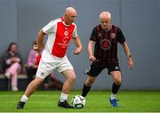14 June 2025; Roger Smith of St Patrick's Athletic in action against Mark Hillen of Bohemians during the League of Ireland Walking Football Festival at the National Indoor Arena on the Sport Ireland Campus in Dublin. Photo by Stephen McCarthy/Sportsfile
