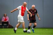 14 June 2025; Roger Smith of St Patrick's Athletic in action against Mark Hillen of Bohemians during the League of Ireland Walking Football Festival at the National Indoor Arena on the Sport Ireland Campus in Dublin. Photo by Stephen McCarthy/Sportsfile