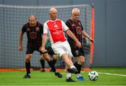14 June 2025; Roger Smith of St Patrick's Athletic in action against Mark Hillen of Bohemians during the League of Ireland Walking Football Festival at the National Indoor Arena on the Sport Ireland Campus in Dublin. Photo by Stephen McCarthy/Sportsfile