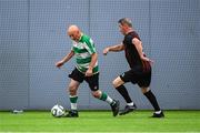 14 June 2025; Larry Brophy of Shamrock Rovers in action against Gerry Black of Bohemians during the League of Ireland Walking Football Festival at the National Indoor Arena on the Sport Ireland Campus in Dublin. Photo by Stephen McCarthy/Sportsfile