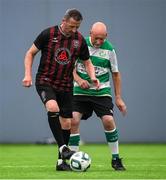14 June 2025; Gerry Black of Bohemians in action against Larry Brophy of Shamrock Rovers during the League of Ireland Walking Football Festival at the National Indoor Arena on the Sport Ireland Campus in Dublin. Photo by Stephen McCarthy/Sportsfile