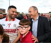 14 June 2025; Míchéal Aodh Martin of Cork celebrates with his dad An Taoiseach Míchéal Martin TD after the GAA Football All-Ireland Senior Championship Round 3 match between Roscommon and Cork at Laois Hire O'Moore Park in Portlaoise, Laois. Photo by Daire Brennan/Sportsfile