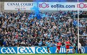 14 June 2025; Dublin supporters celebrate a point during the GAA Football All-Ireland Senior Championship Round 3 match between Dublin and Derry at Páirc Esler in Newry, Down. Photo by Thomas Flinkow/Sportsfile