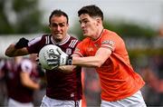 14 June 2025; Jarly Óg Burns of Armagh in action against John Maher of Galway during the GAA Football All-Ireland Senior Championship Round 3 match between Galway and Armagh at Kingspan Breffni in Cavan. Photo by Ben McShane/Sportsfile