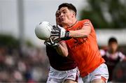 14 June 2025; Jarly Óg Burns of Armagh in action against John Maher of Galway during the GAA Football All-Ireland Senior Championship Round 3 match between Galway and Armagh at Kingspan Breffni in Cavan. Photo by Ben McShane/Sportsfile