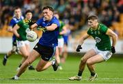 14 June 2025; David Clifford of Kerry in action against Seán Rafferty of Meath during the GAA Football All-Ireland Senior Championship Round 3 match between Kerry and Meath at Glenisk O'Connor Park in Tullamore, Offaly. Photo by Tom Beary/Sportsfile