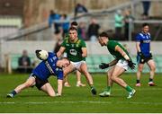 14 June 2025; Jason Foley of Kerry in action against Ruairi Kinsella, left, and Seán Coffey of Meath during the GAA Football All-Ireland Senior Championship Round 3 match between Kerry and Meath at Glenisk O'Connor Park in Tullamore, Offaly. Photo by Tom Beary/Sportsfile