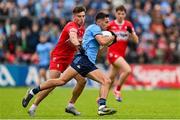 14 June 2025; Niall Scully of Dublin in action against Conor Doherty of Derry during the GAA Football All-Ireland Senior Championship Round 3 match between Dublin and Derry at Páirc Esler in Newry, Down. Photo by Ramsey Cardy/Sportsfile