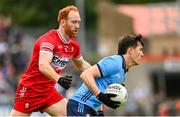 14 June 2025; Killian McGinnis of Dublin in action against Conor Glass of Derry during the GAA Football All-Ireland Senior Championship Round 3 match between Dublin and Derry at Páirc Esler in Newry, Down. Photo by Ramsey Cardy/Sportsfile