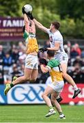 14 June 2025; Jack McEvoy of Offaly in action against Kevin Feely of Kildare during the Tailteann Cup quarter-final match between Kildare and Offaly at Cedral St Conleth's Park in Newbridge, Kildare. Photo by Piaras Ó Mídheach/Sportsfile