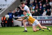 14 June 2025; Jack McEvoy of Offaly in action against Colm Dalton of Kildare during the Tailteann Cup quarter-final match between Kildare and Offaly at Cedral St Conleth's Park in Newbridge, Kildare. Photo by Piaras Ó Mídheach/Sportsfile