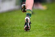14 June 2025; A substitute warms up on a wet sideline during the TG4 All-Ireland Ladies Football Senior Championship Round 3 match between Kildare and Meath at Manguard Plus Kildare GAA Centre of Excellence in Newbridge, Kildare. Photo by Ray McManus/Sportsfile